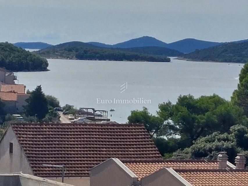 Modern two-story apartment with sea view in a good location, Tisno