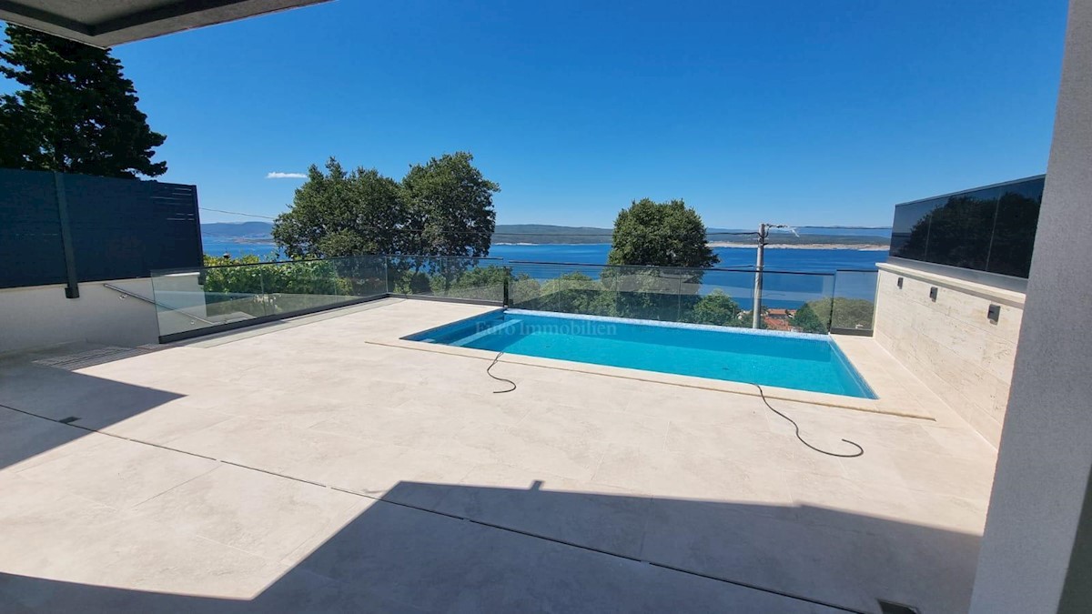 Modern house with a pool and a panoramic view of the sea