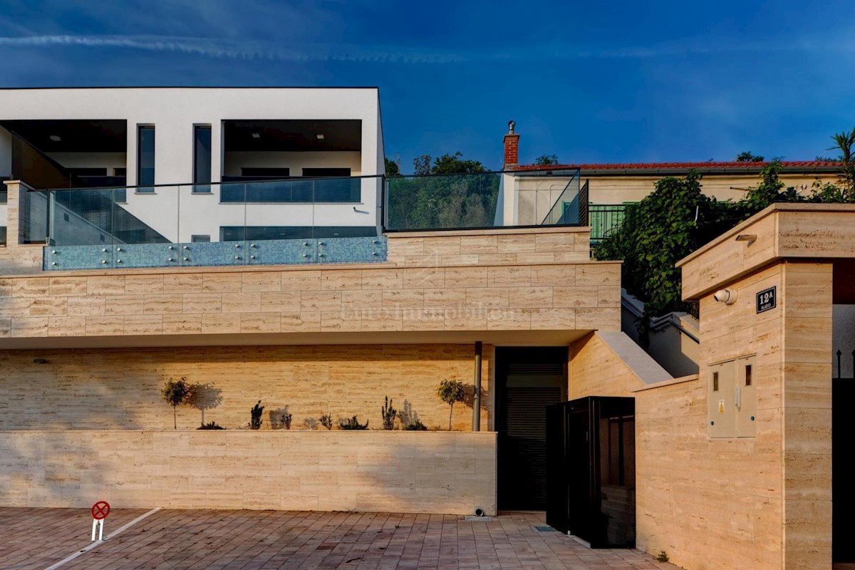 Modern house with a pool and a panoramic view of the sea