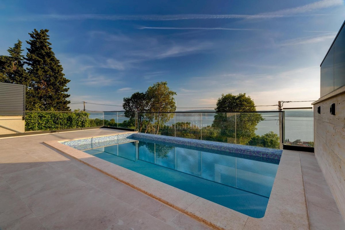 Modern house with a pool and a panoramic view of the sea