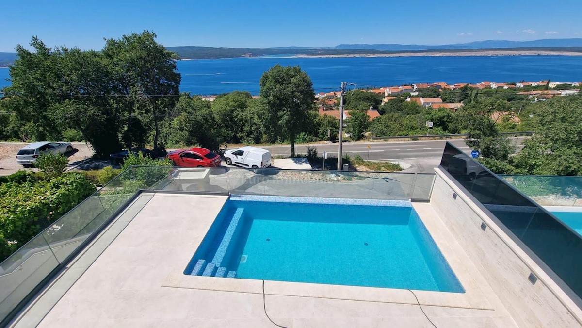 Modern house with a pool and a panoramic view of the sea