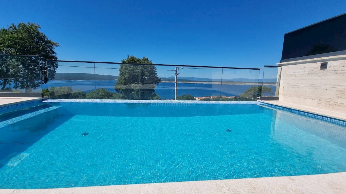 Modern house with a pool and a panoramic view of the sea