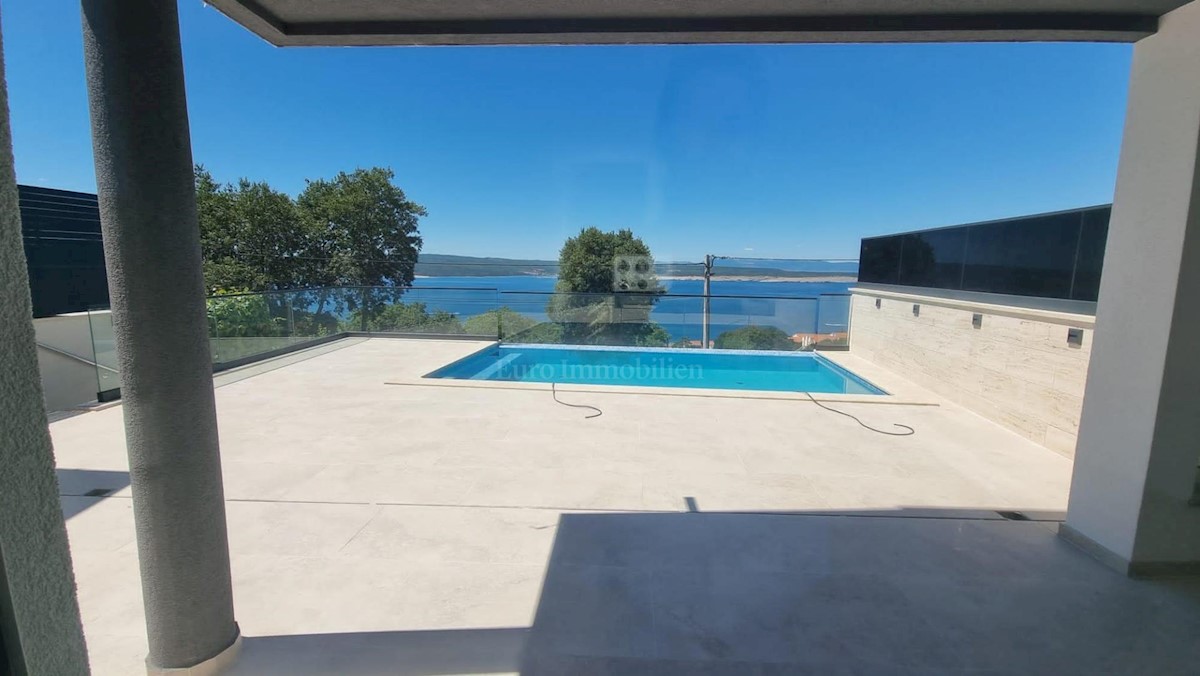 Modern house with a pool and a panoramic view of the sea