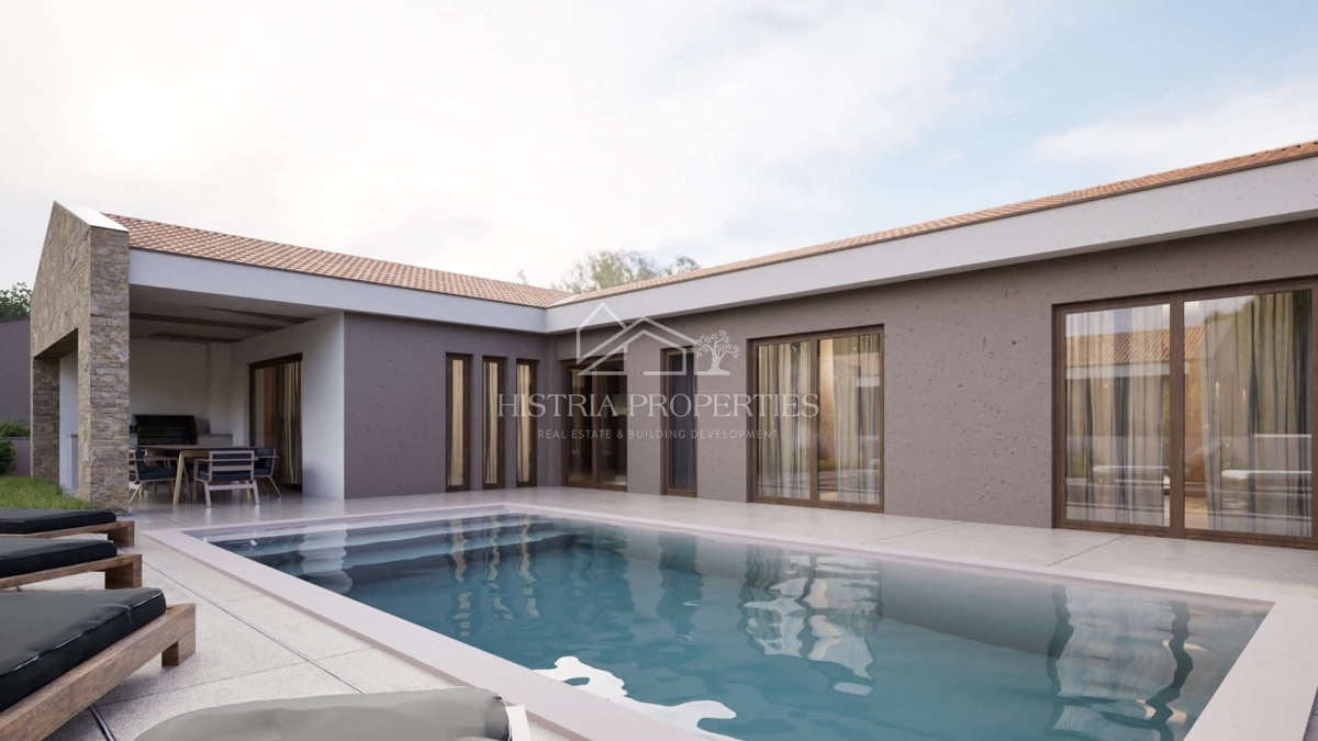 Una casa a un piano dal design moderno con piscina e servizi ausiliari