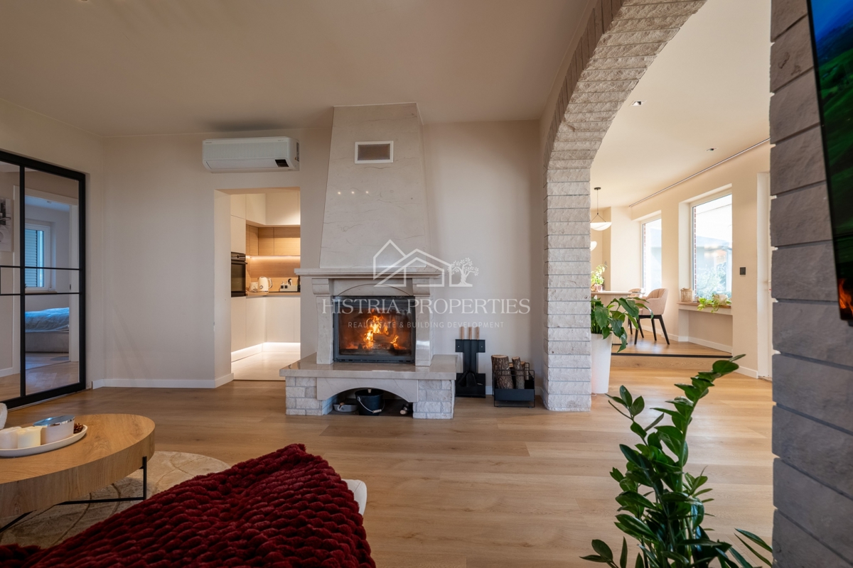 Casa con uliveto su ampio terreno edificabile e appartamento ristrutturato con grande potenziale