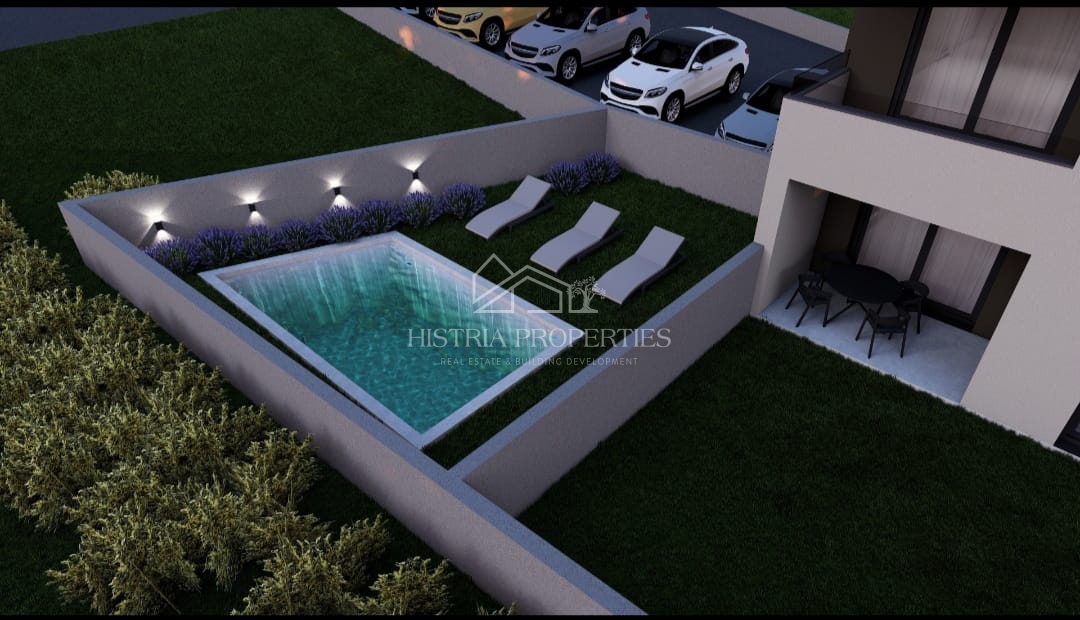 Appartamento con piscina e giardino al piano terra di una nuova palazzina per una piacevole vacanza