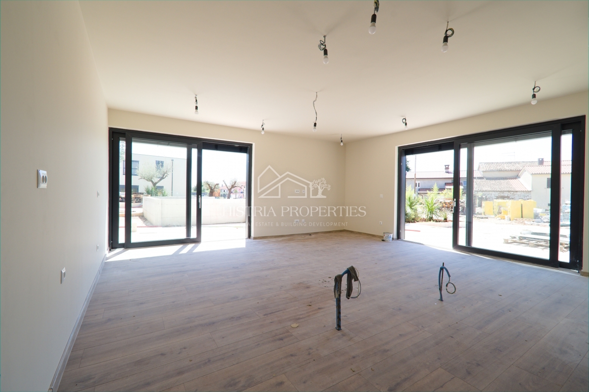 Appartamento al piano terra con piscina in comune in un lussuoso edificio di nuova costruzione