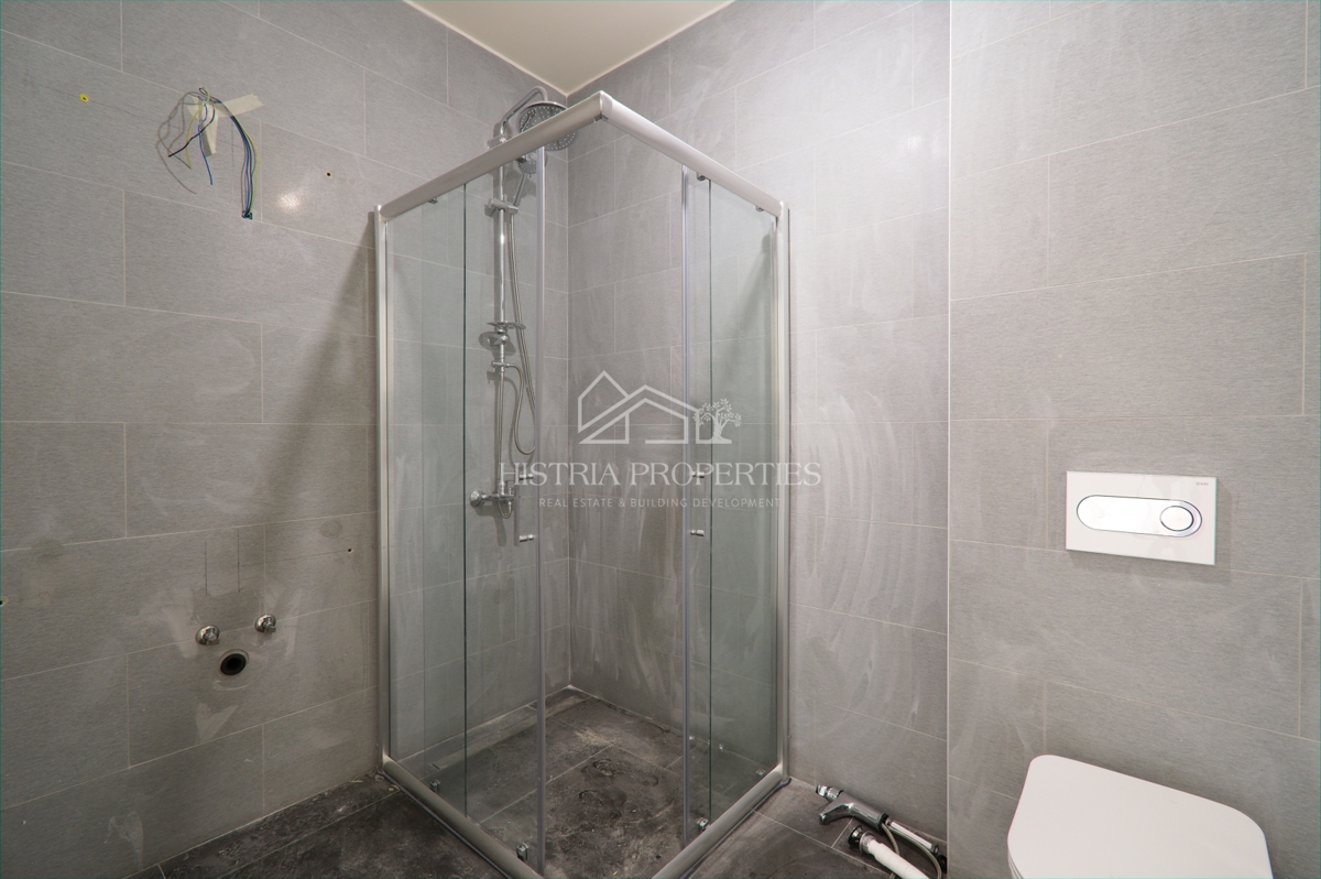 Appartamento al piano terra con piscina in comune in un lussuoso edificio di nuova costruzione