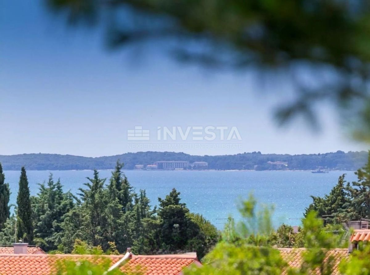 Barbariga, terreno con permesso di costruzione, vista mare