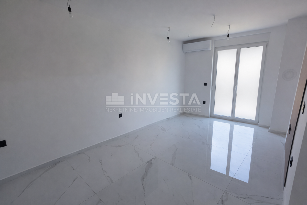 Appartamento con una camera da letto e giardino in nuova costruzione con certificato di agibilità