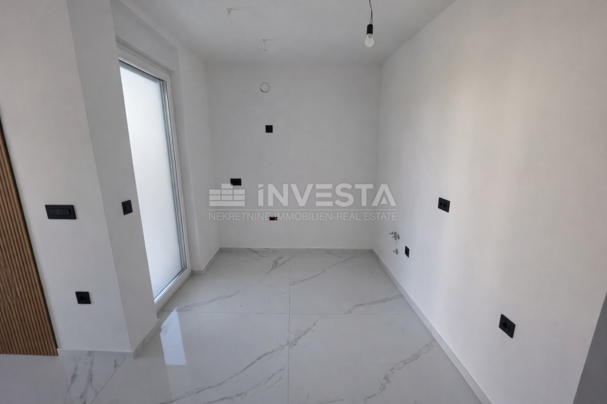 Appartamento con una camera da letto e giardino in nuova costruzione con certificato di agibilità