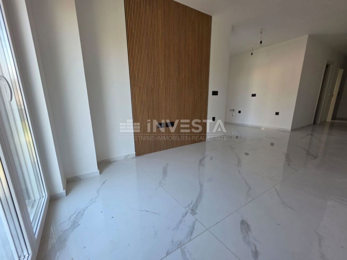 Appartamento con una camera da letto e giardino in nuova costruzione con certificato di agibilità