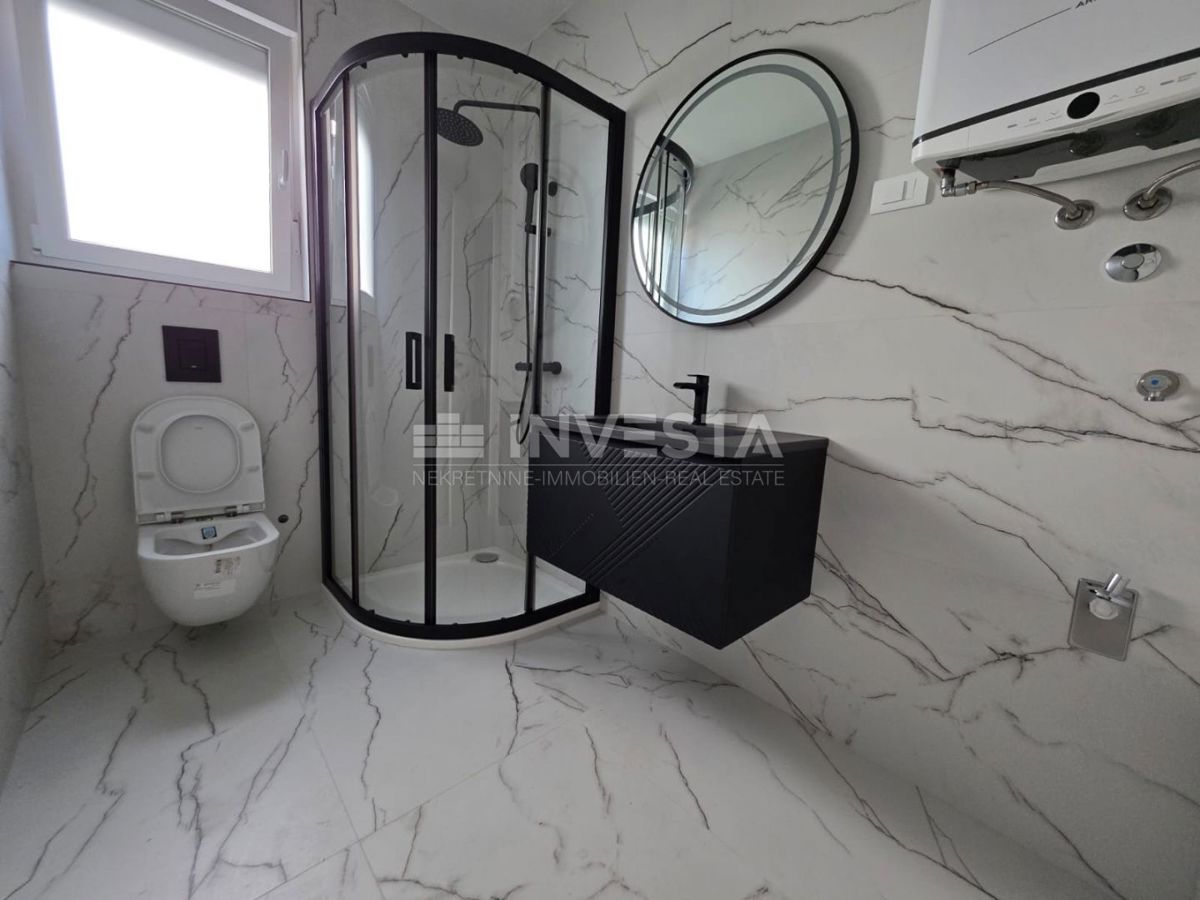 Appartamento con una camera da letto e giardino in nuova costruzione con certificato di agibilità