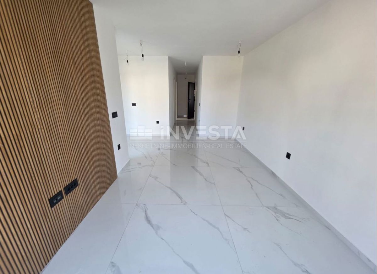 Appartamento con una camera da letto e giardino in nuova costruzione con certificato di agibilità