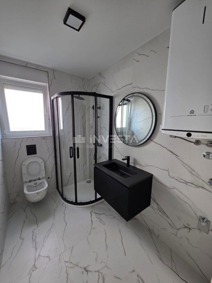 Appartamento con una camera da letto e giardino in nuova costruzione con certificato di agibilità