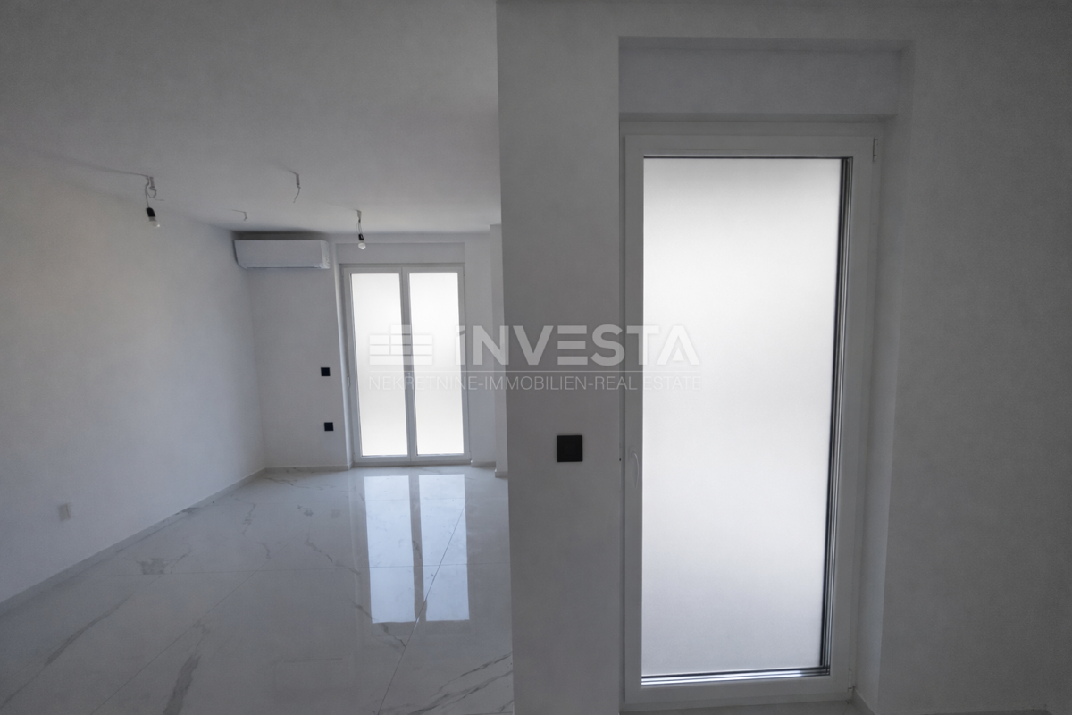 Appartamento con una camera da letto e giardino in nuova costruzione con certificato di agibilità