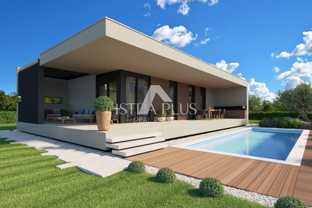 Una casa contemporanea a un piano dal design moderno ai margini del villaggio con vista aperta