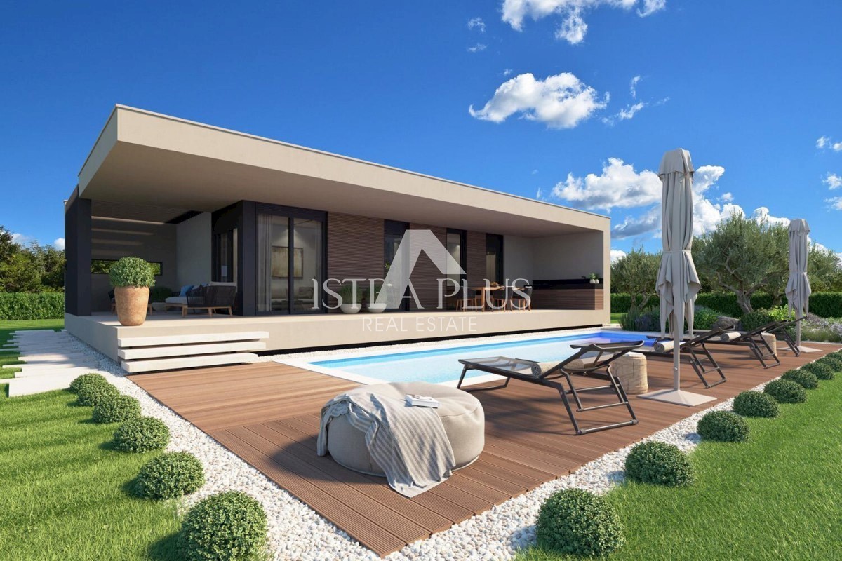 Una casa contemporanea a un piano dal design moderno ai margini del villaggio con vista aperta
