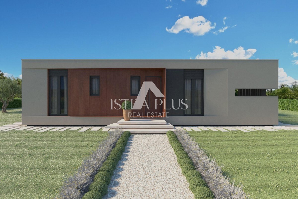 Una casa contemporanea a un piano dal design moderno ai margini del villaggio con vista aperta