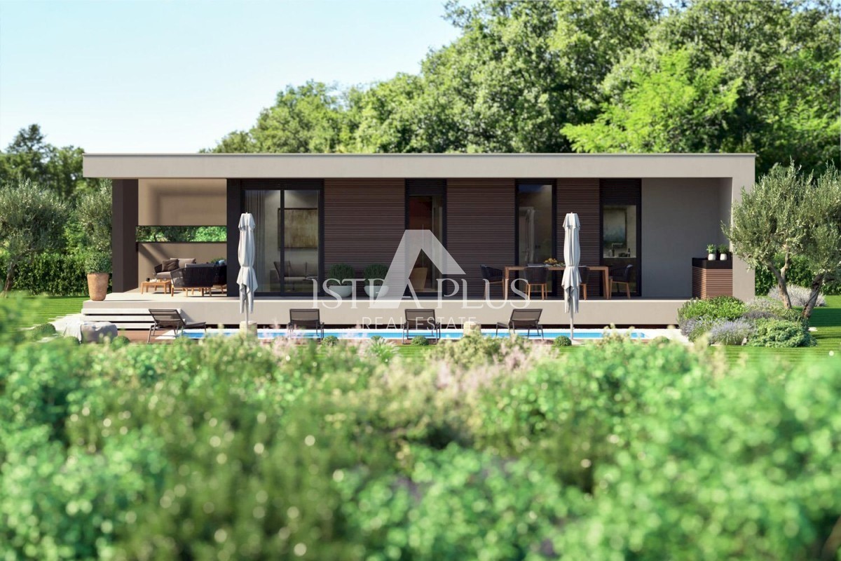 Una casa contemporanea a un piano dal design moderno ai margini del villaggio con vista aperta