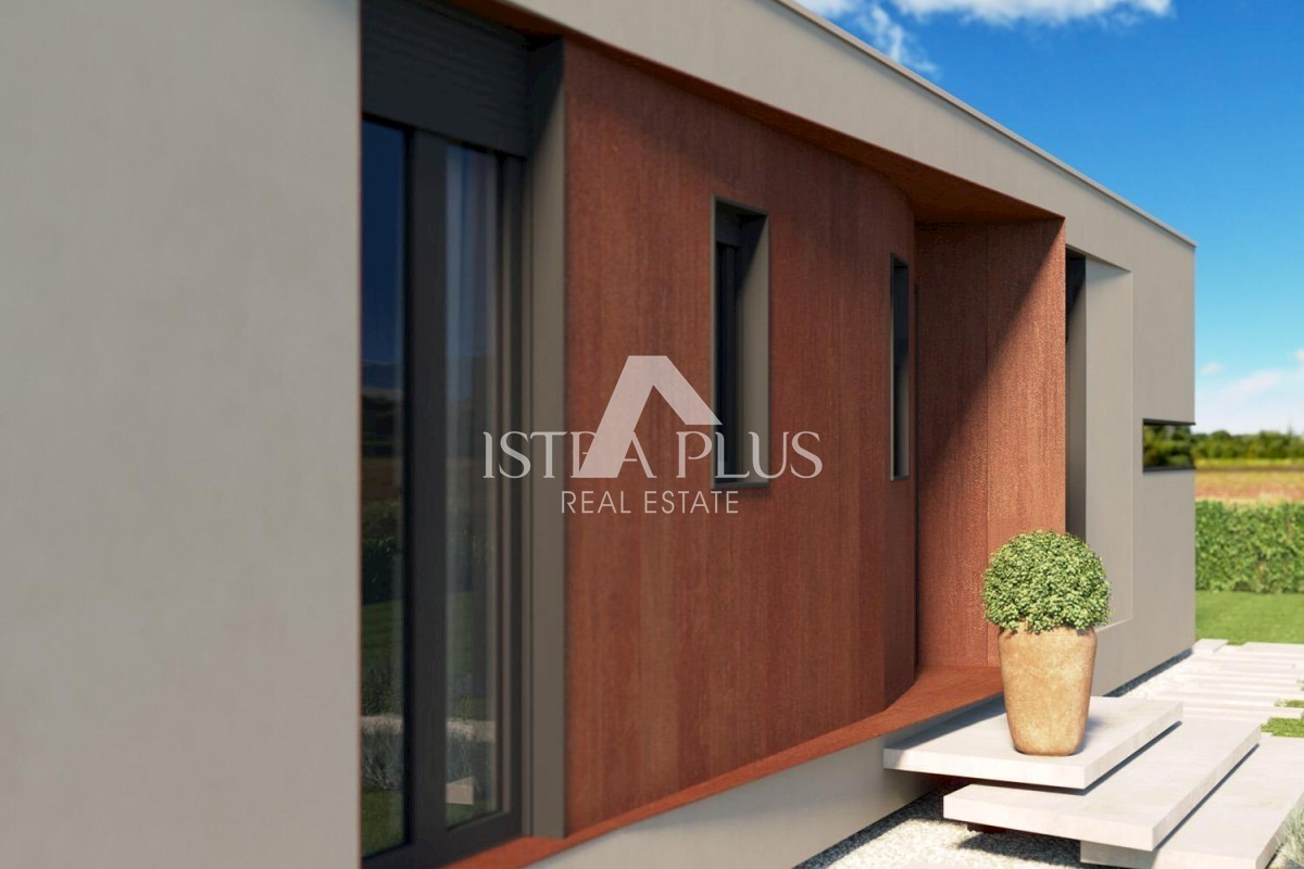Una casa contemporanea a un piano dal design moderno ai margini del villaggio con vista aperta