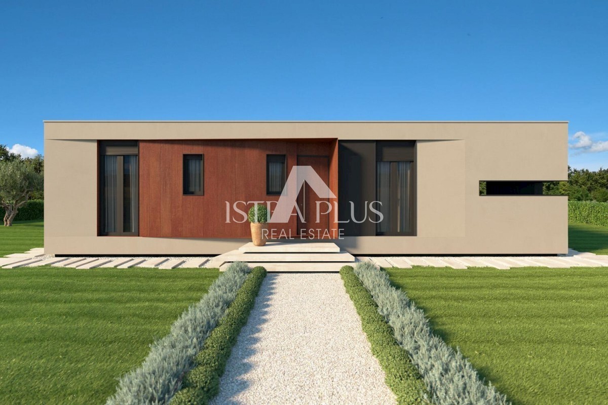 Una casa contemporanea a un piano dal design moderno ai margini del villaggio con vista aperta