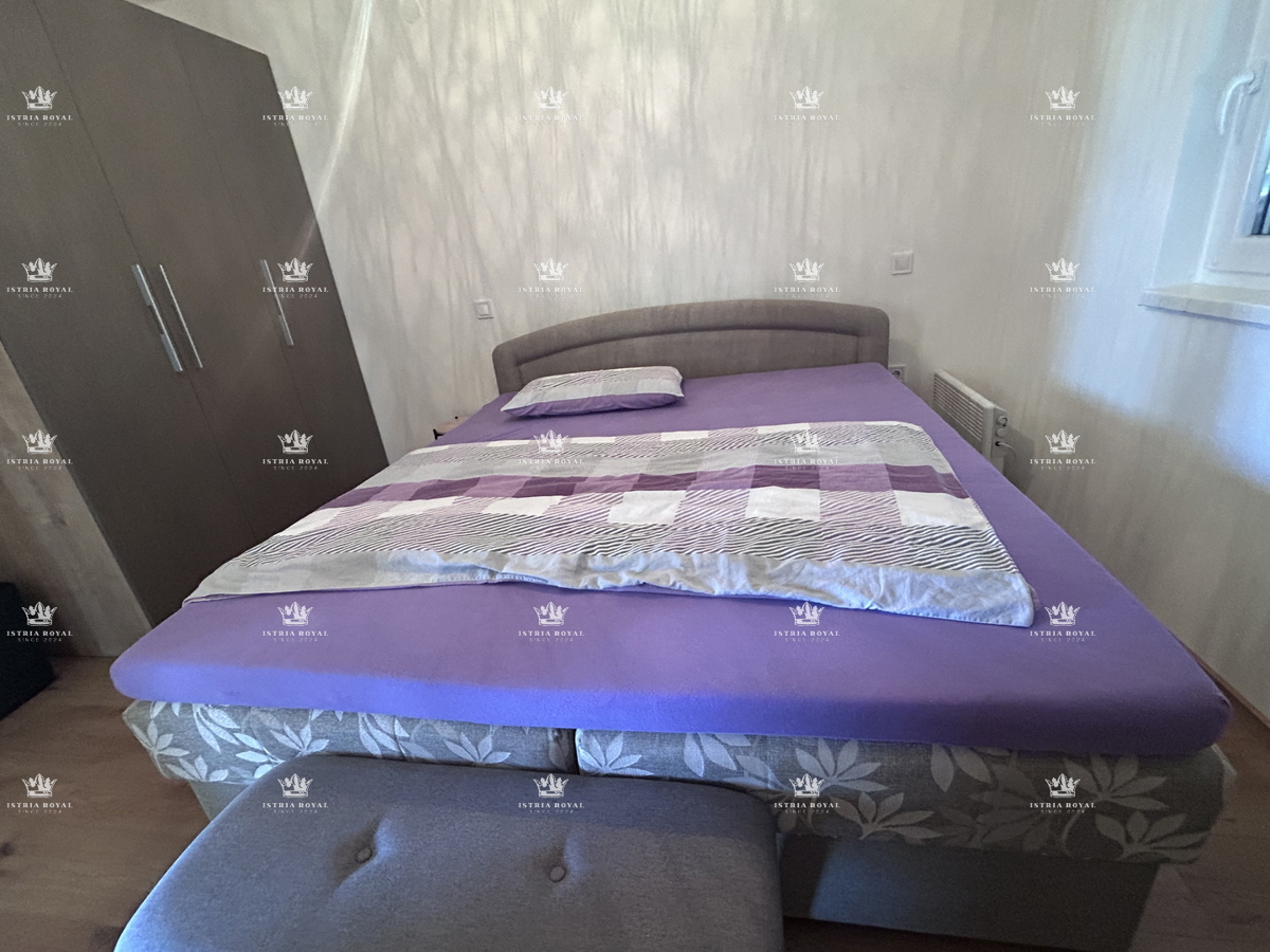 Vendita appartamento nel centro di Brtonigla con vista mare | 84 m², due camere da letto, terrazza e parcheggio