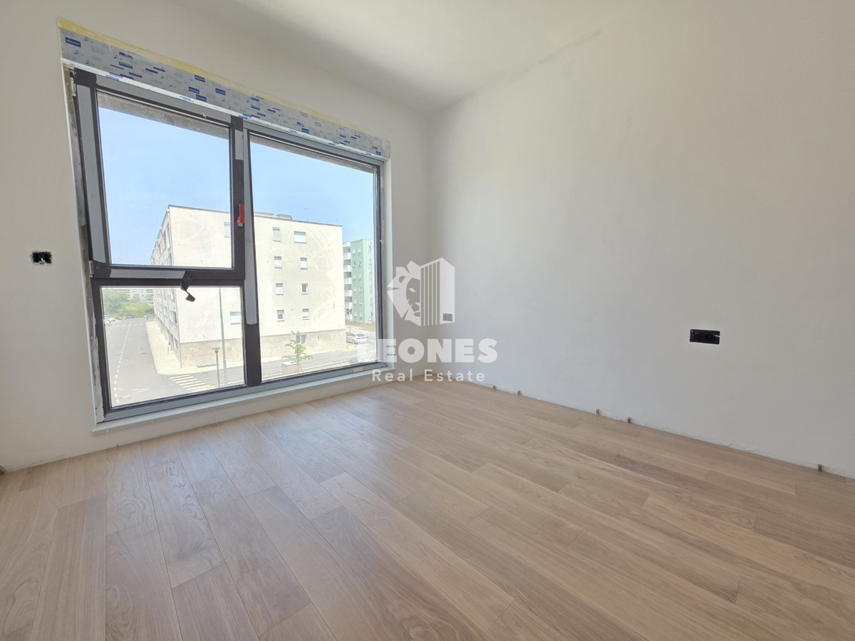 Appartamento in un edificio di nuova costruzione di qualità con posto auto coperto in Umag - Umago