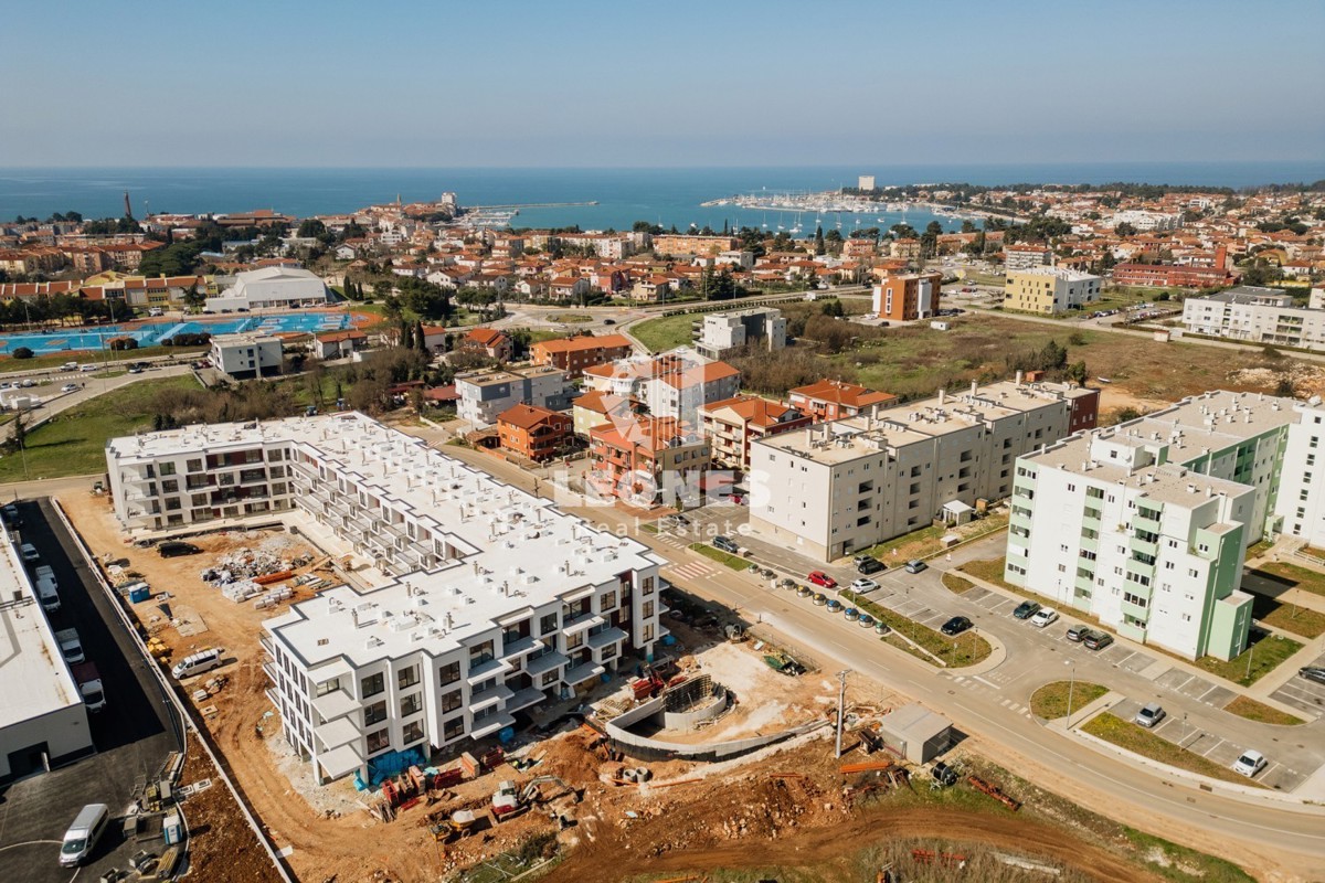 Appartamento con posto auto in garage in un moderno edificio di nuova costruzione a Umag - Umago