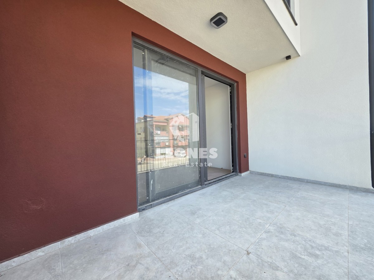 Appartamento con posto auto coperto in un edificio di nuova costruzione di qualità a Umag - Umago