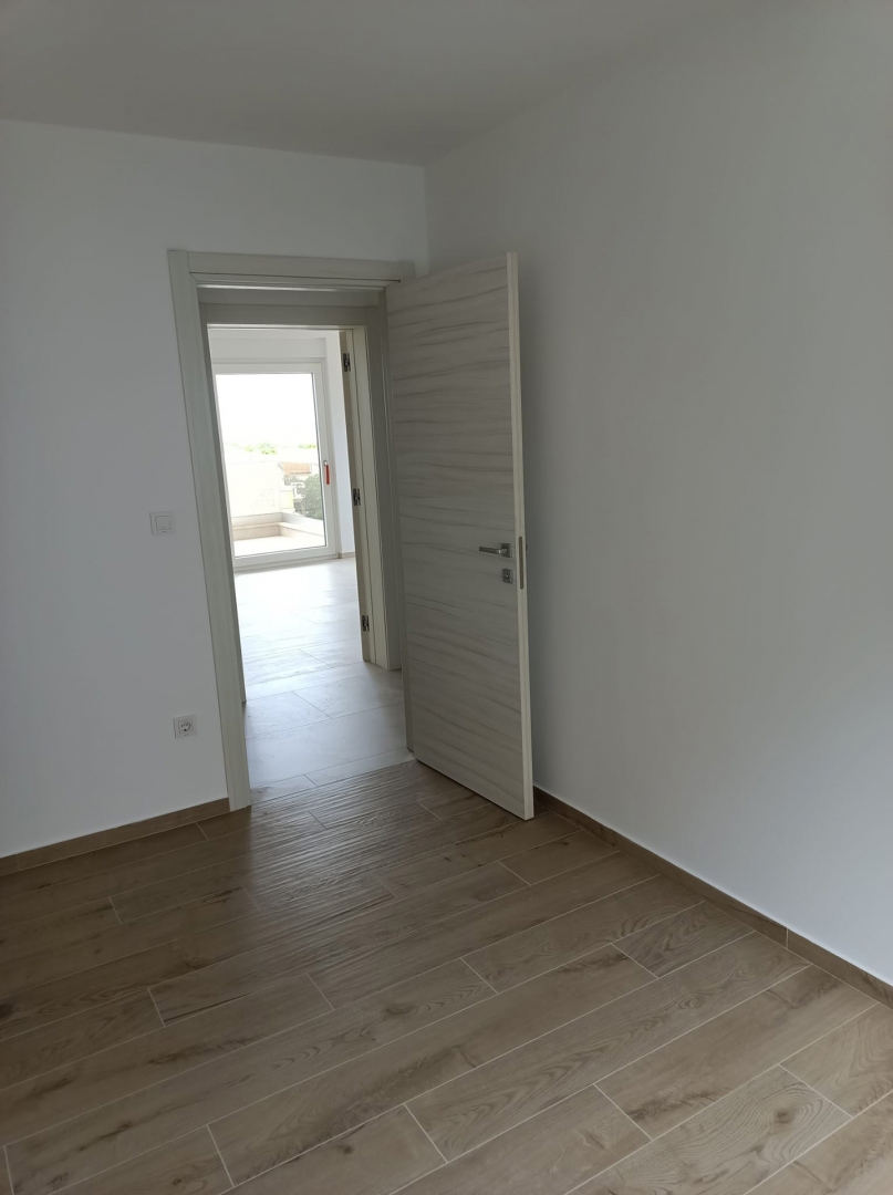 ISOLA DI PAG, POVLJANA - Appartamento con due camere da letto in un edificio di nuova costruzione.