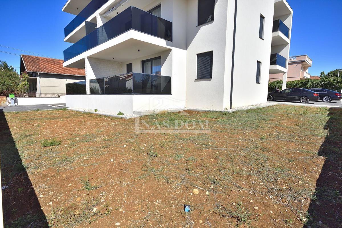 Vodice - *NEW BUILDING* apartment on the ground floor with garden and garage, 650 m from the beach