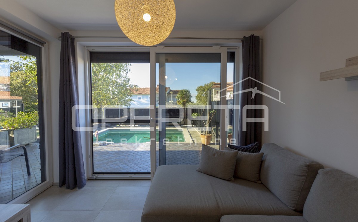 Appartamento al piano terra con piscina riscaldata.