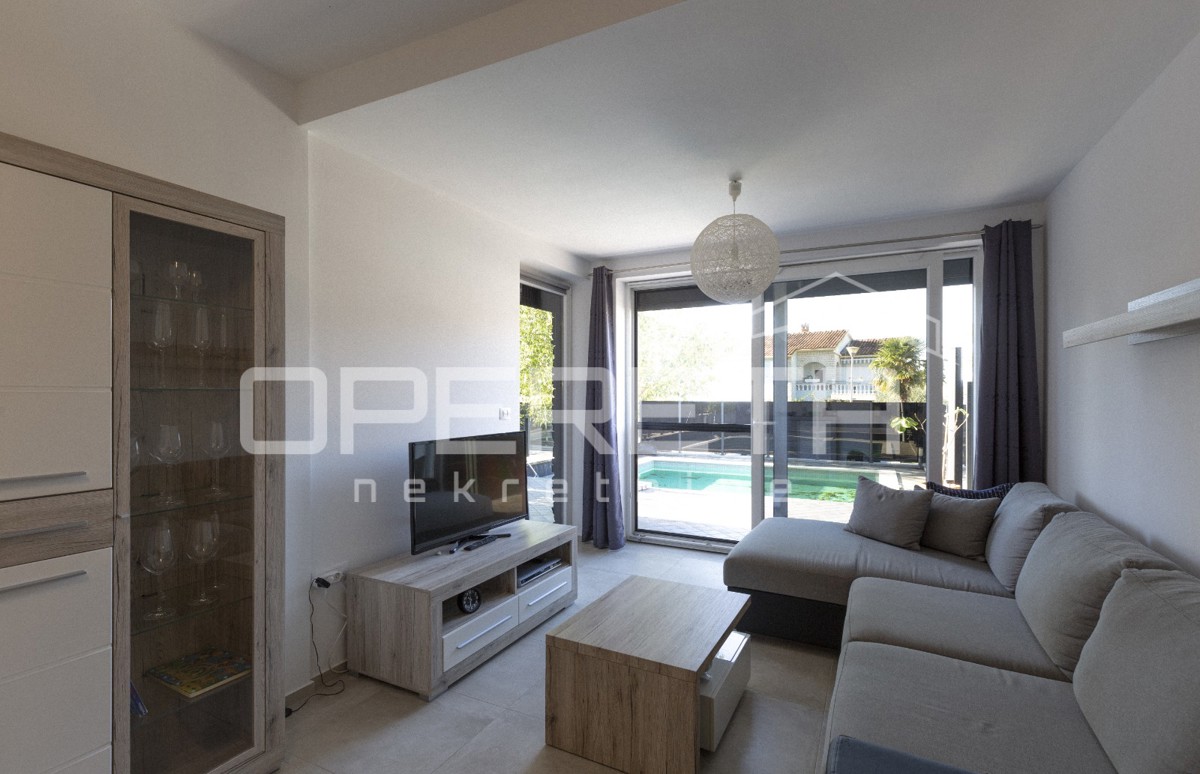 Appartamento al piano terra con piscina riscaldata.