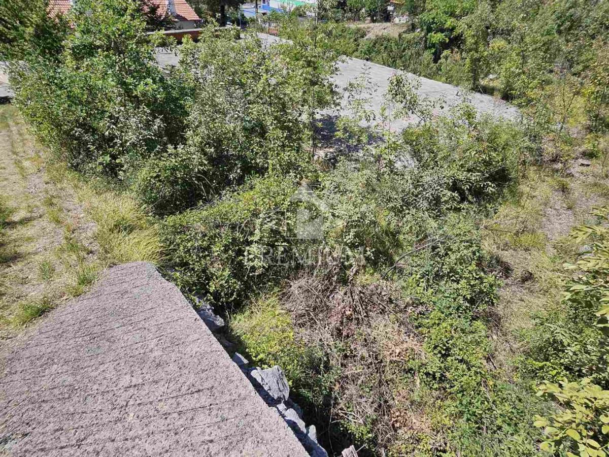 TERRENO CON COSTRUZIONE INIZIATA