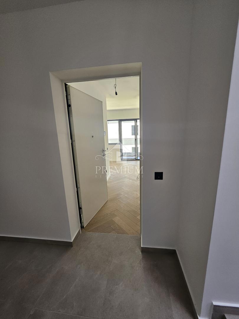 APPARTAMENTO IN NUOVA COSTRUZIONE, ASCENSORE, POSTO AUTO, GIARDINO