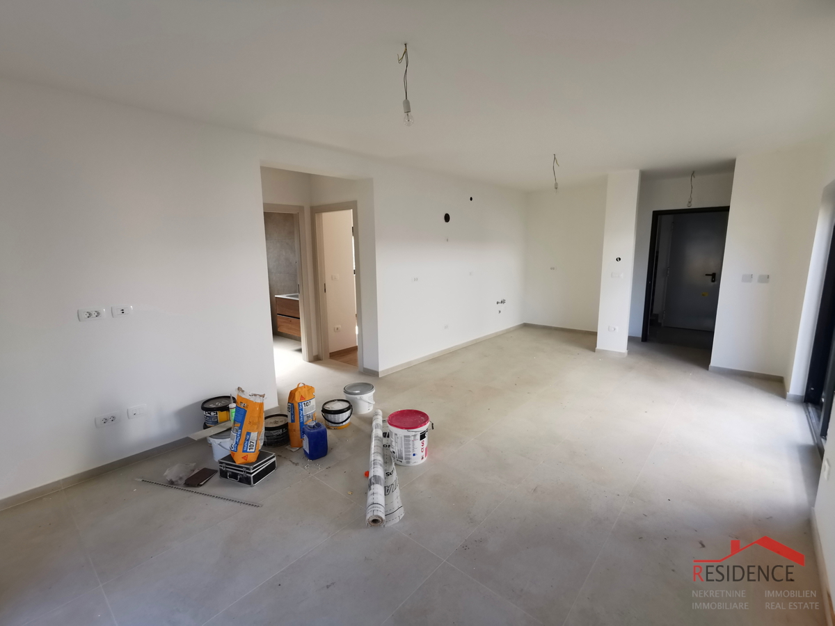 Medolino, nuova costruzione, appartamento al piano terra con giardino