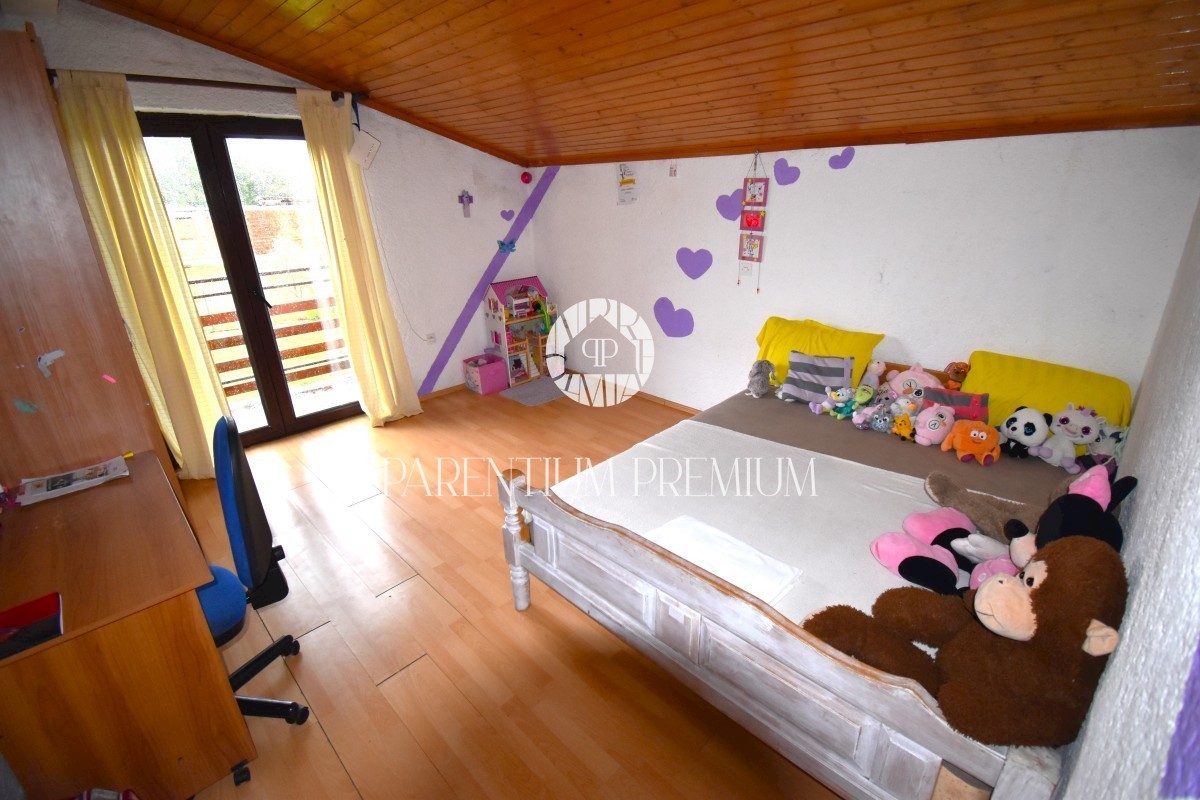 Casa con 2 unità abitative in posizione tranquilla