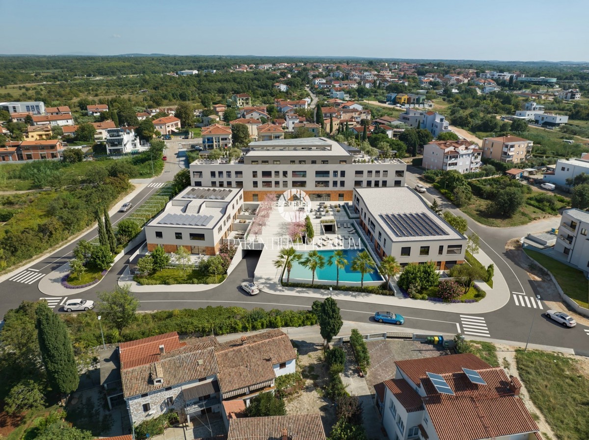 Appartamento in moderna palazzina con piscina e garage a 900m dal mare