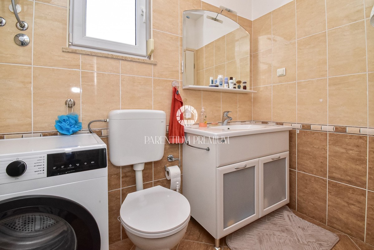 Casa con due appartamenti e un bel curato cortile