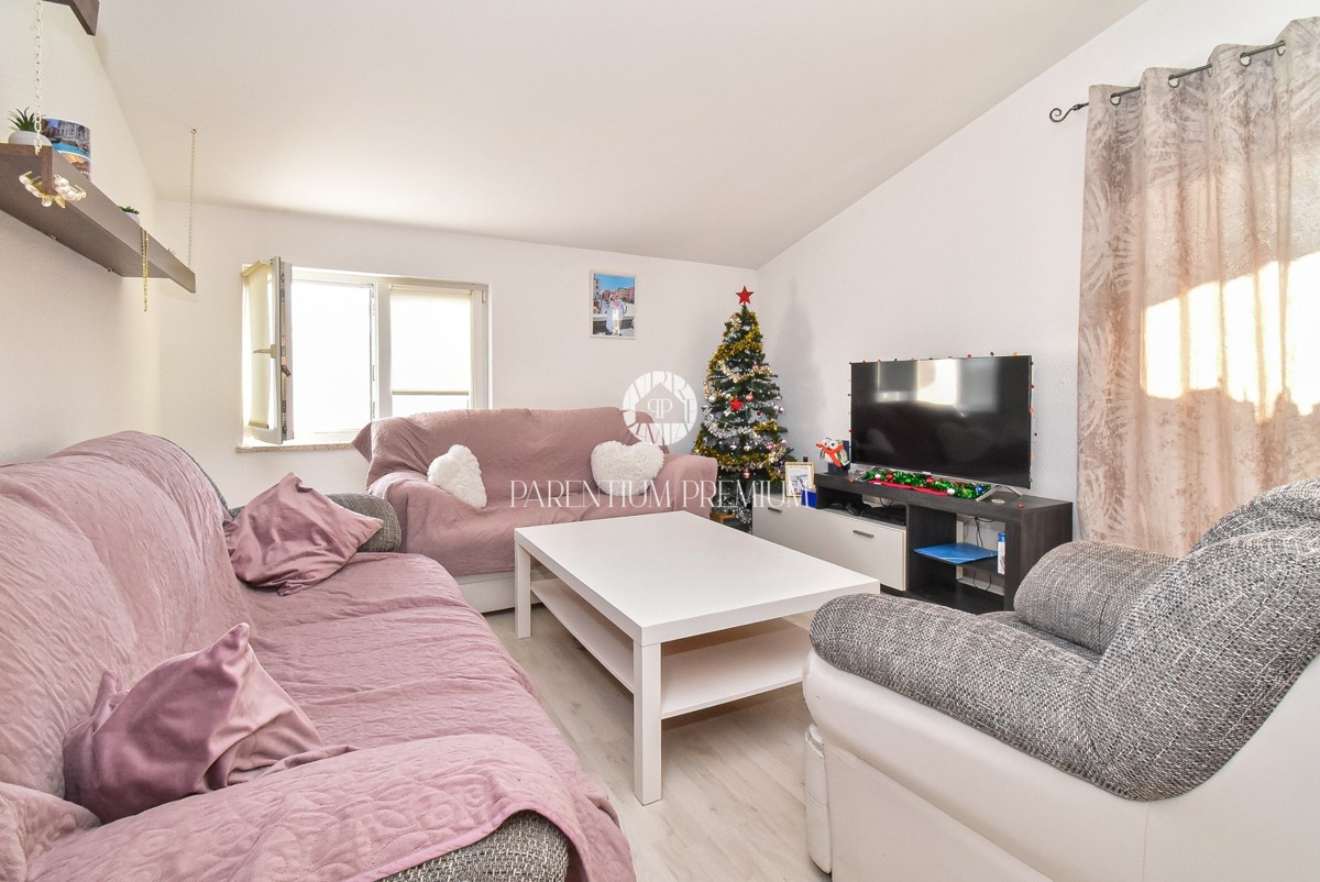 Ampia casa con due appartamenti, grande giardino e taverna