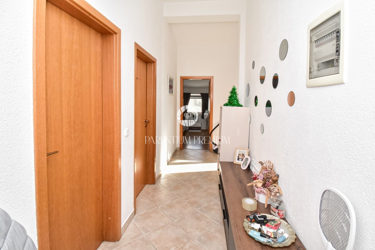 Ampia casa con due appartamenti, grande giardino e taverna