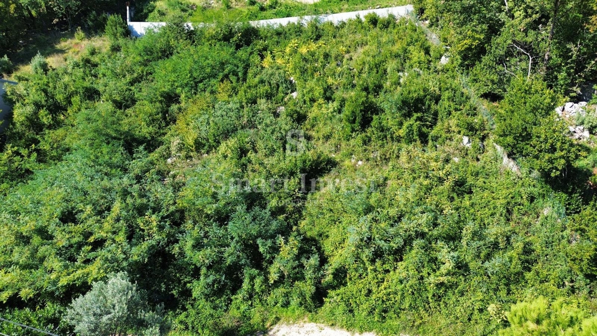 LOVRAN, terreno con permesso di costruire per una casa, vista mare