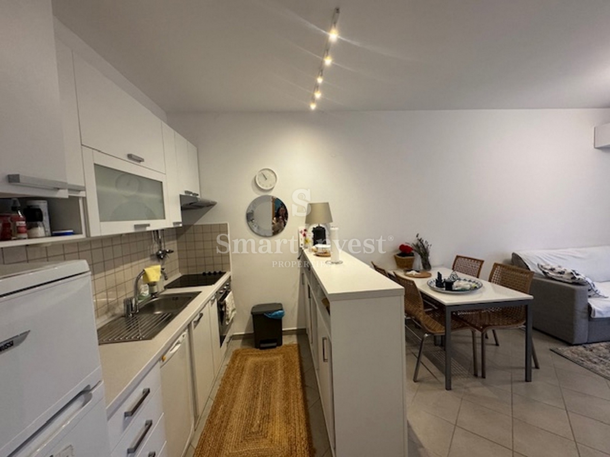 ABBAZIA, appartamento bilocale con parcheggio in edificio con piscina