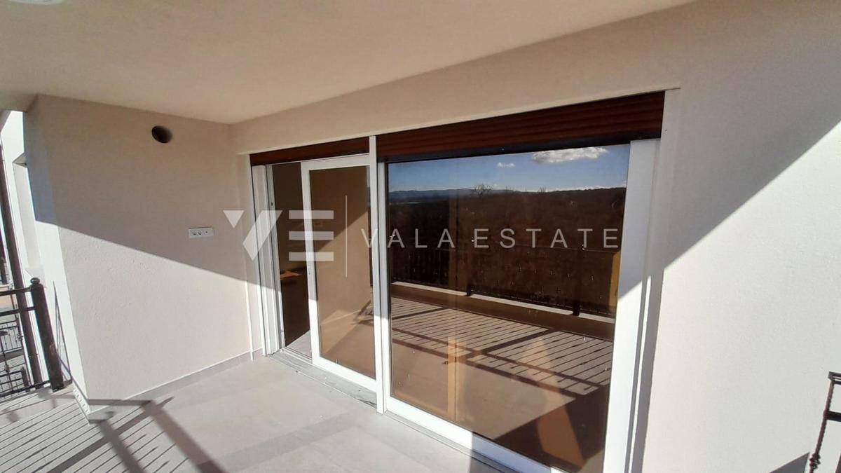 BILOCALE AL PRIMO PIANO DI NUOVA COSTRUZIONE CON VISTA MARE