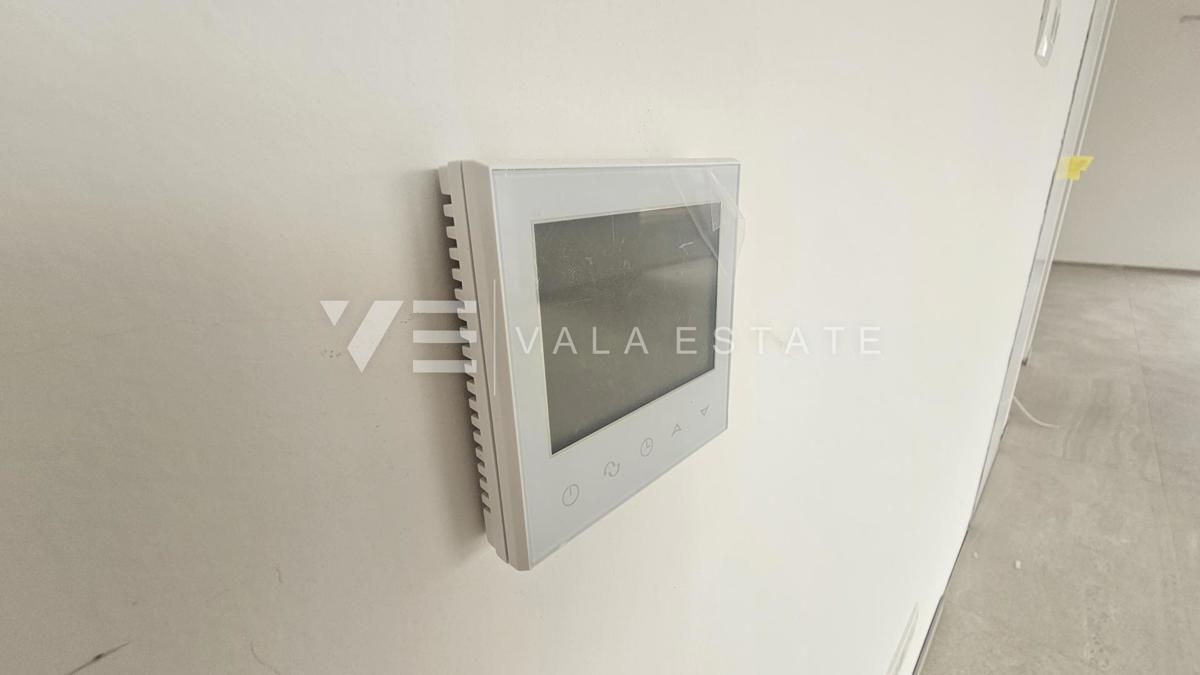 APPARTAMENTO SU DUE PIANI IN UN NUOVO EDIFICIO CON VISTA MARE