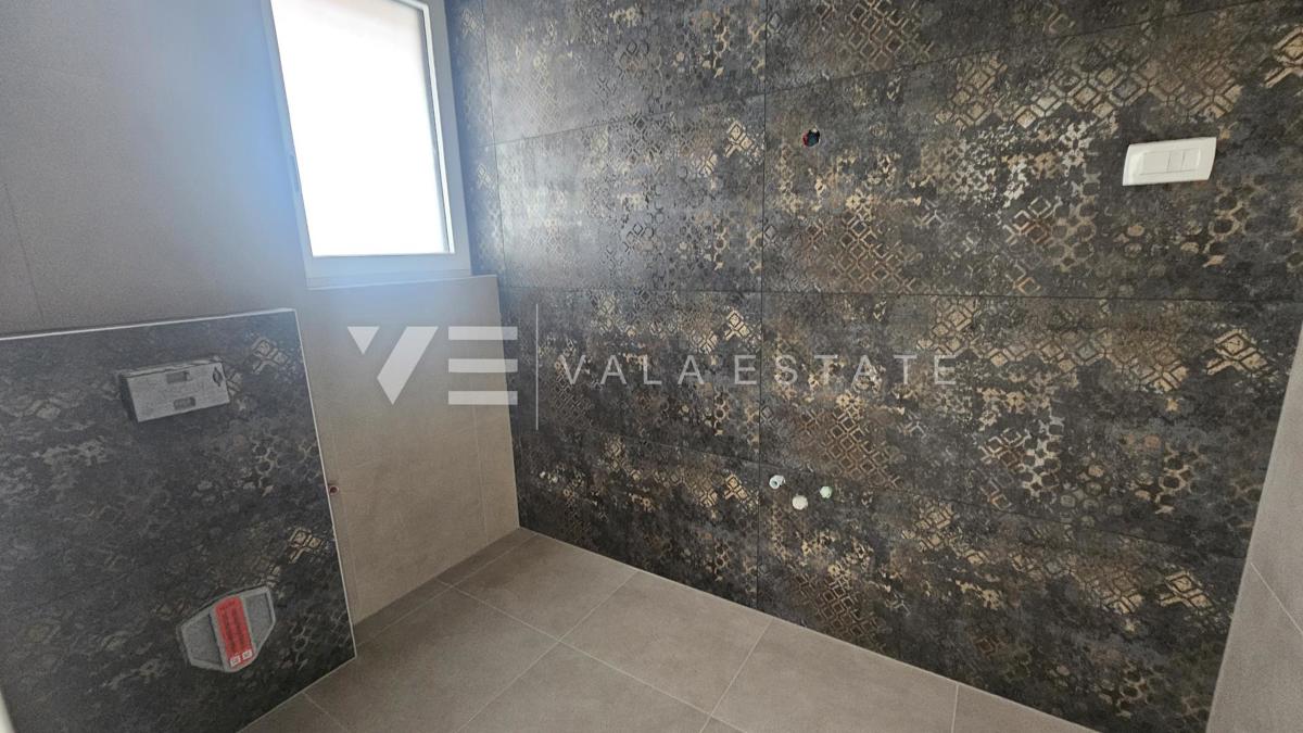 APPARTAMENTO SU DUE PIANI IN UN NUOVO EDIFICIO CON VISTA MARE